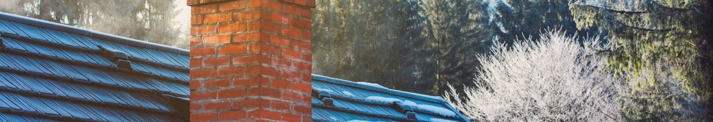 Mountain cottage chimney in winter